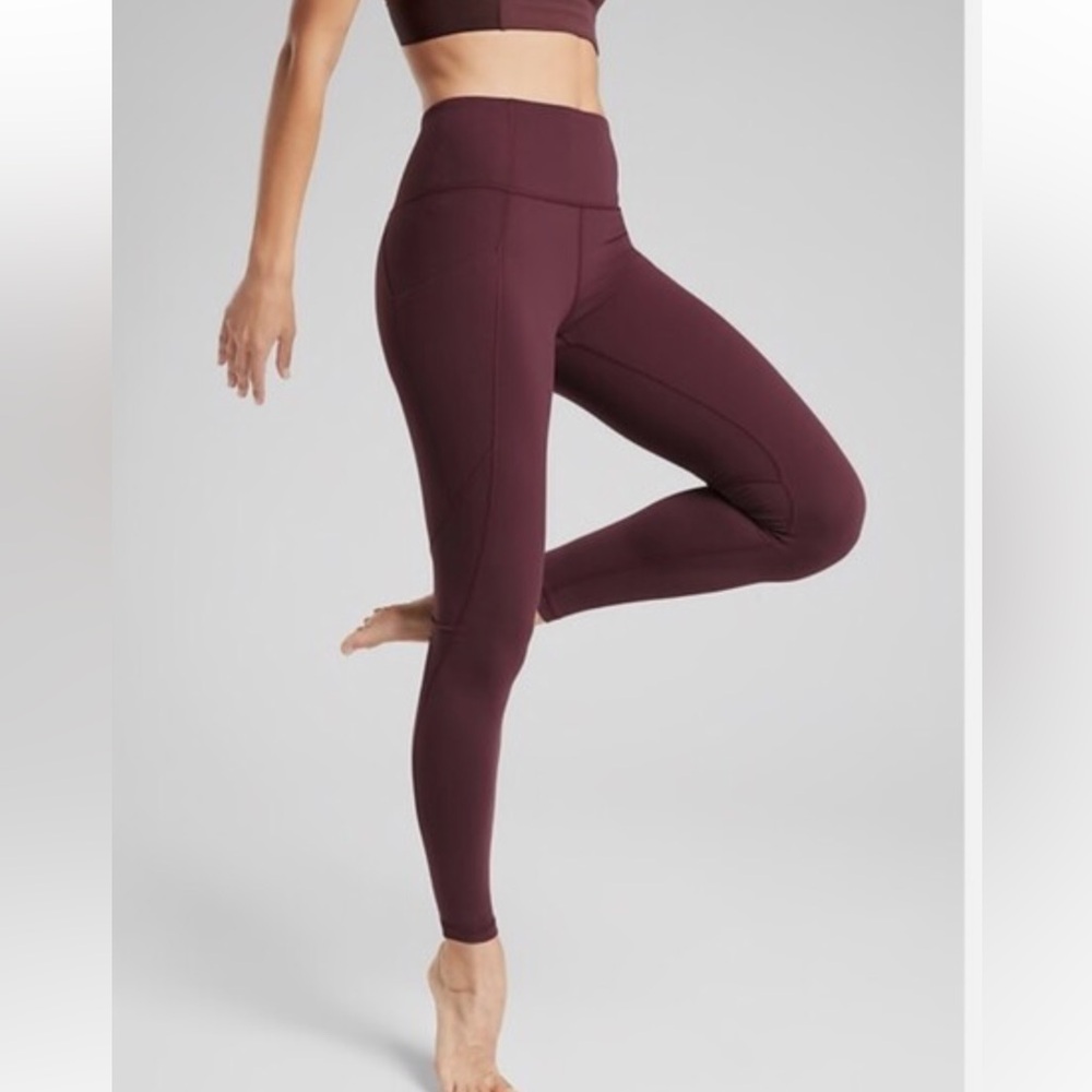 Athleta | Stash pocket salutation tight (size XSP)